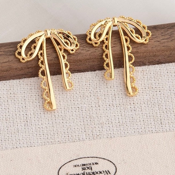 The Shringar Golden Ribbon Charm Earrings